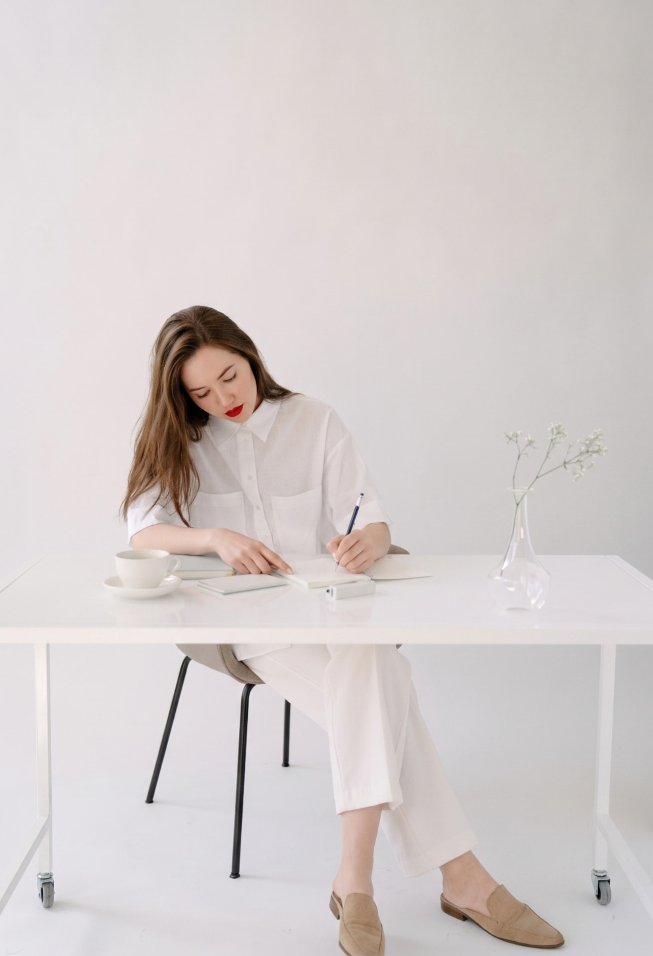 Flora working at her desk